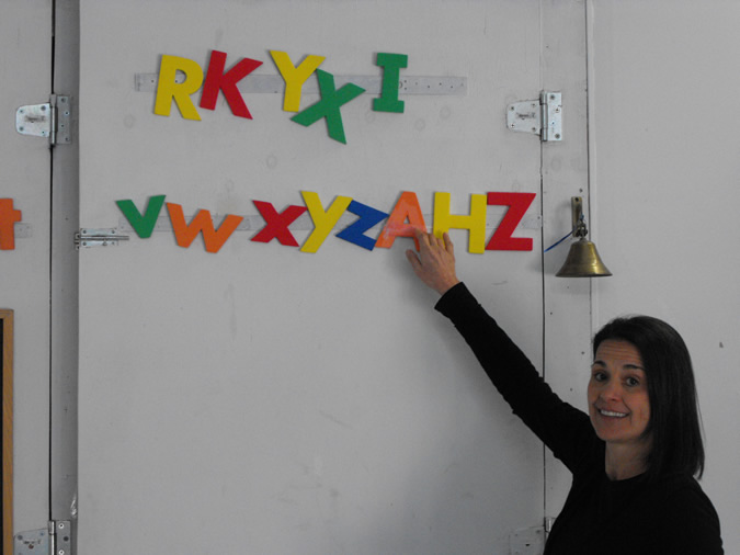We teach reading in an empty room with just letters for visuals. All lessons are taught through puppetry, skits and games.